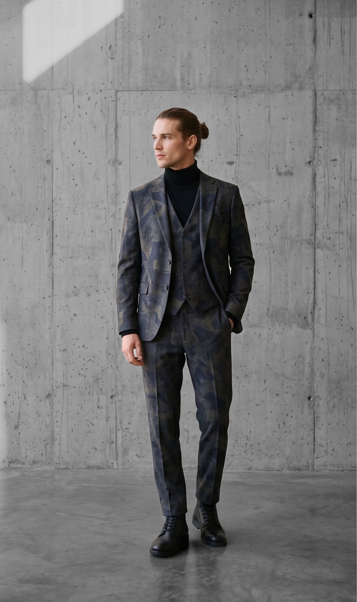 Three-piece camouflage wool suit worn with a black roll-neck