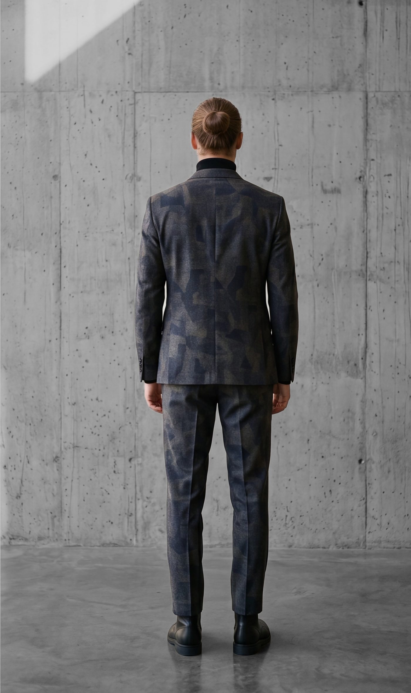 The suit from behind, camouflage pattern running across the back