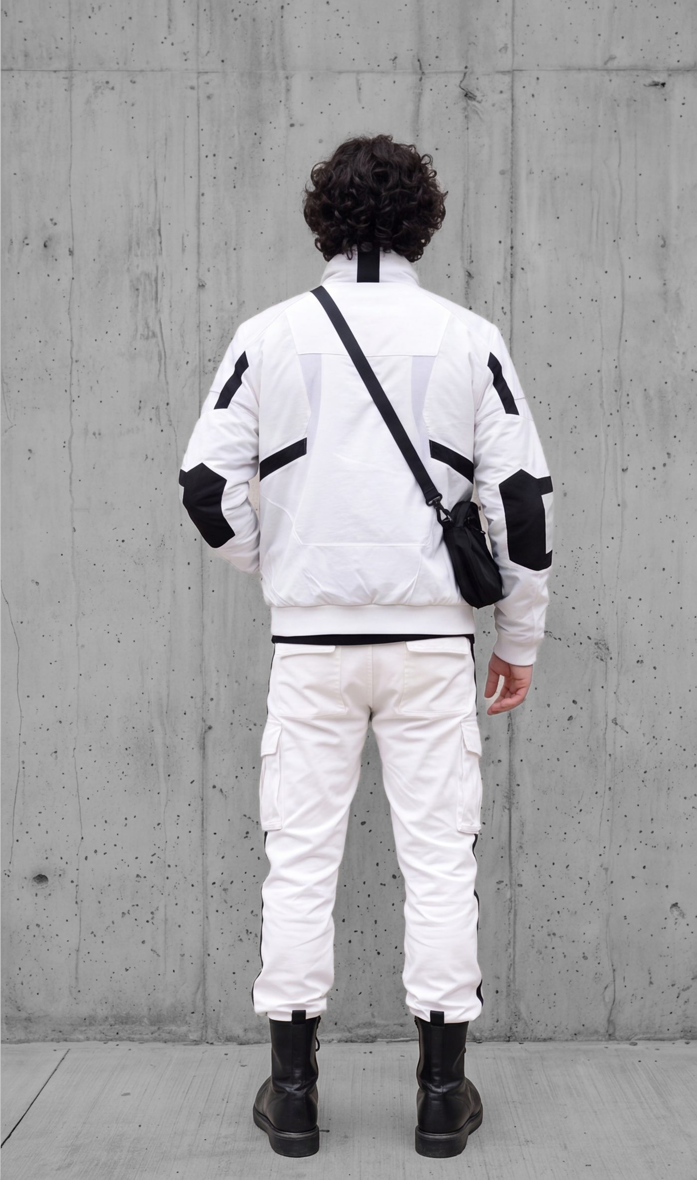 The set from behind, tape lines resolving across the back